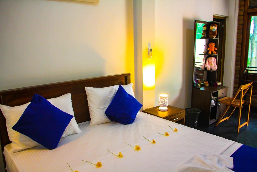 Postel nebo postele na pokoji v ubytování Sigiriya Dream Inn