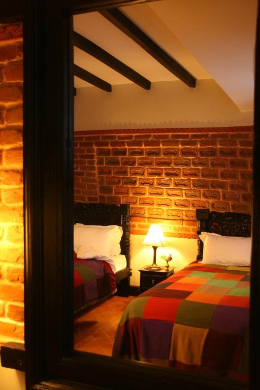 Postel nebo postele na pokoji v ubytování Hotel Heritage