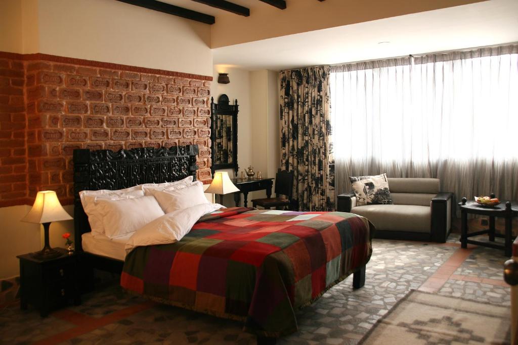 Postel nebo postele na pokoji v ubytování Hotel Heritage