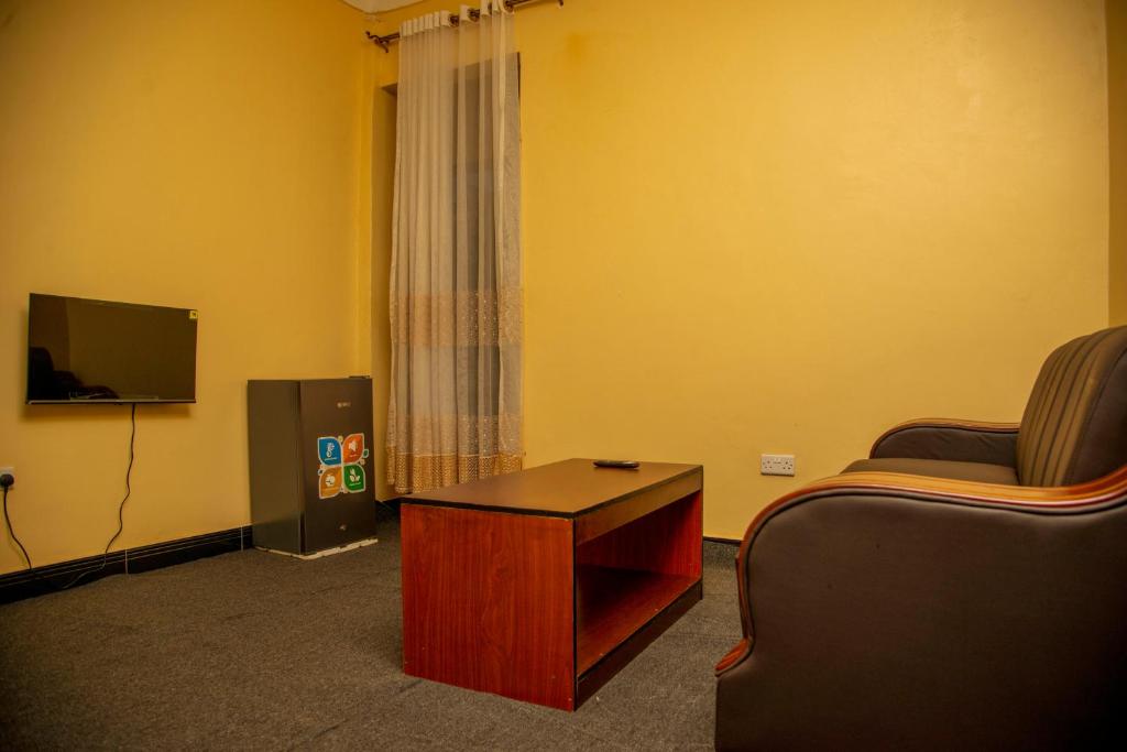 TV a/nebo společenská místnost v ubytování PK Sleek Suites