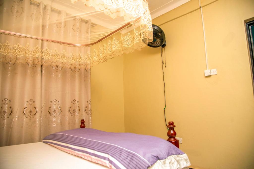 Postel nebo postele na pokoji v ubytování PK Sleek Suites