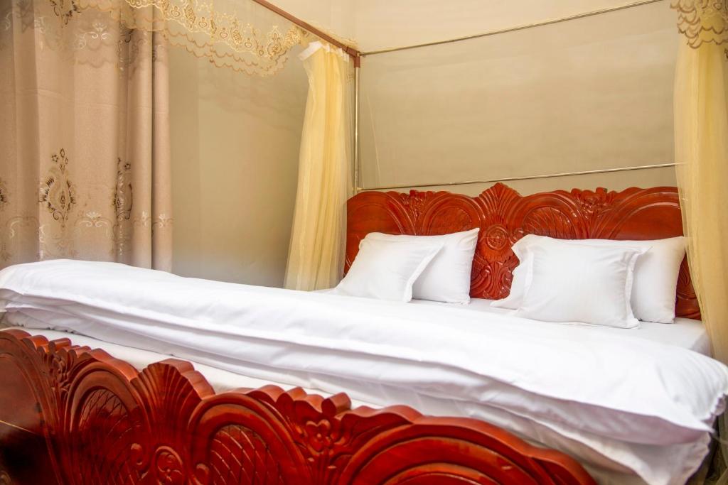 Postel nebo postele na pokoji v ubytování PK Sleek Suites