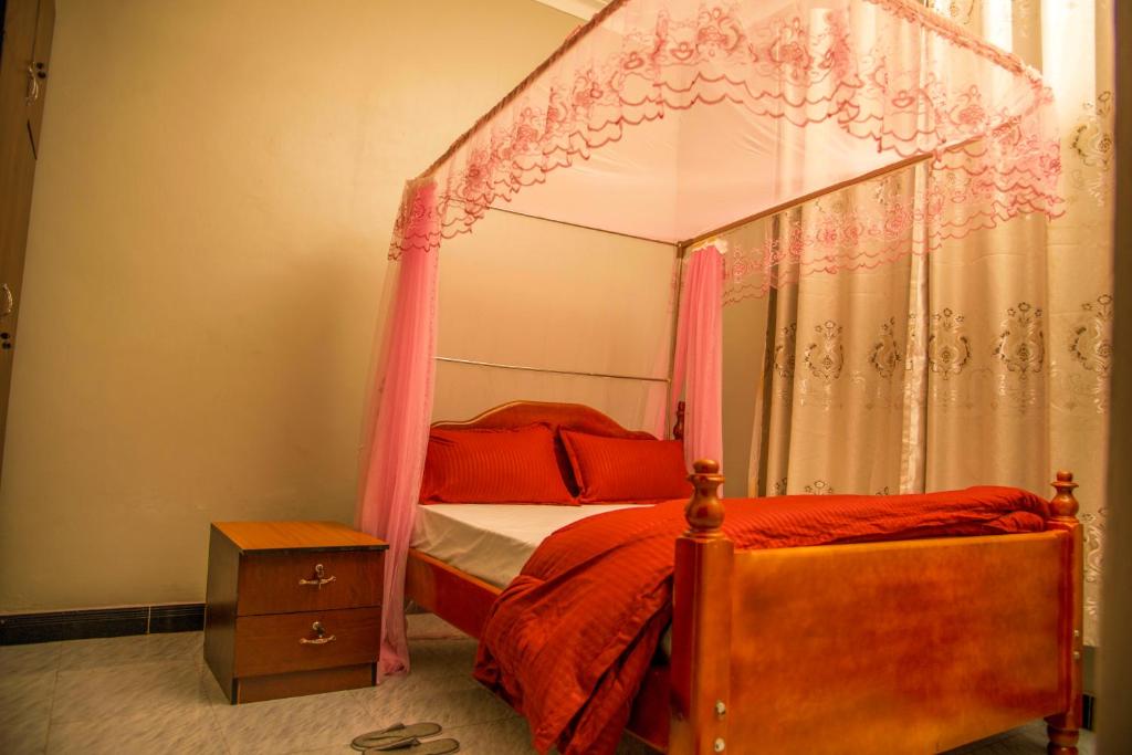 Postel nebo postele na pokoji v ubytování PK Sleek Suites
