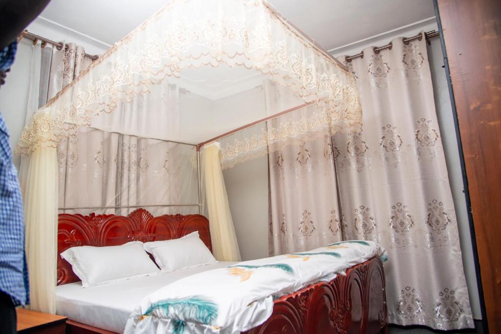 Postel nebo postele na pokoji v ubytování PK Sleek Suites