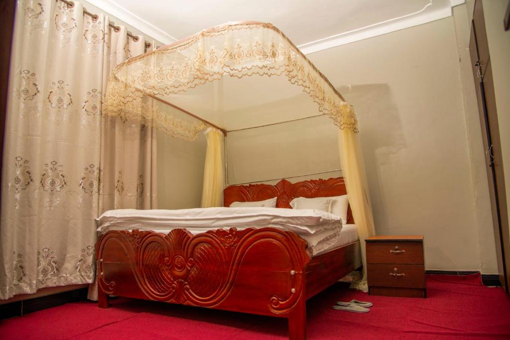 Postel nebo postele na pokoji v ubytování PK Sleek Suites