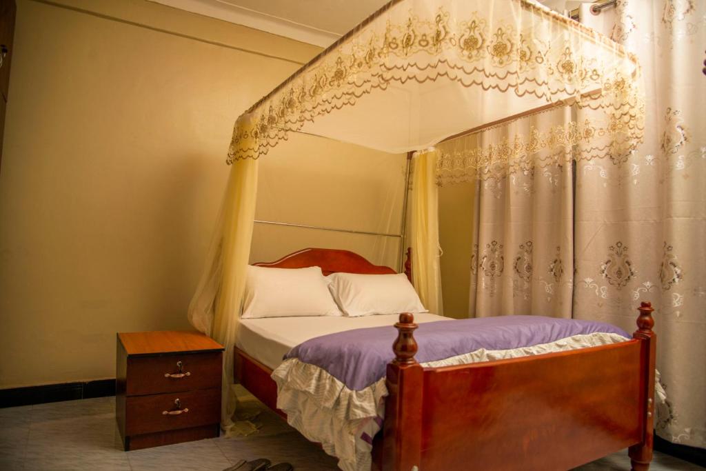 Postel nebo postele na pokoji v ubytování PK Sleek Suites