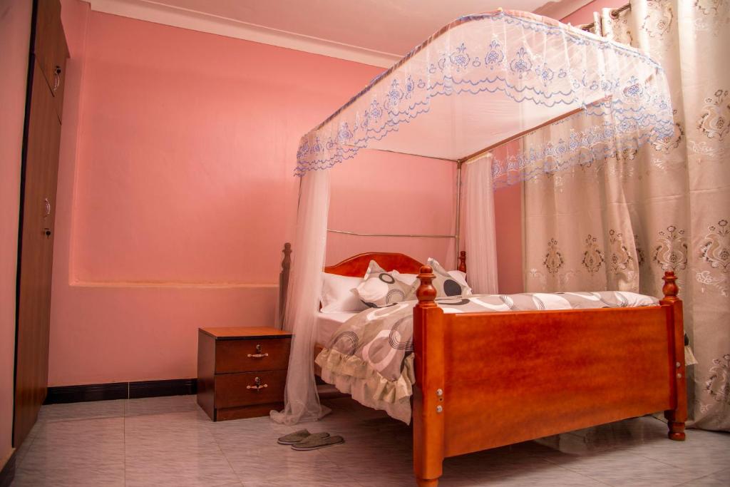 Postel nebo postele na pokoji v ubytování PK Sleek Suites