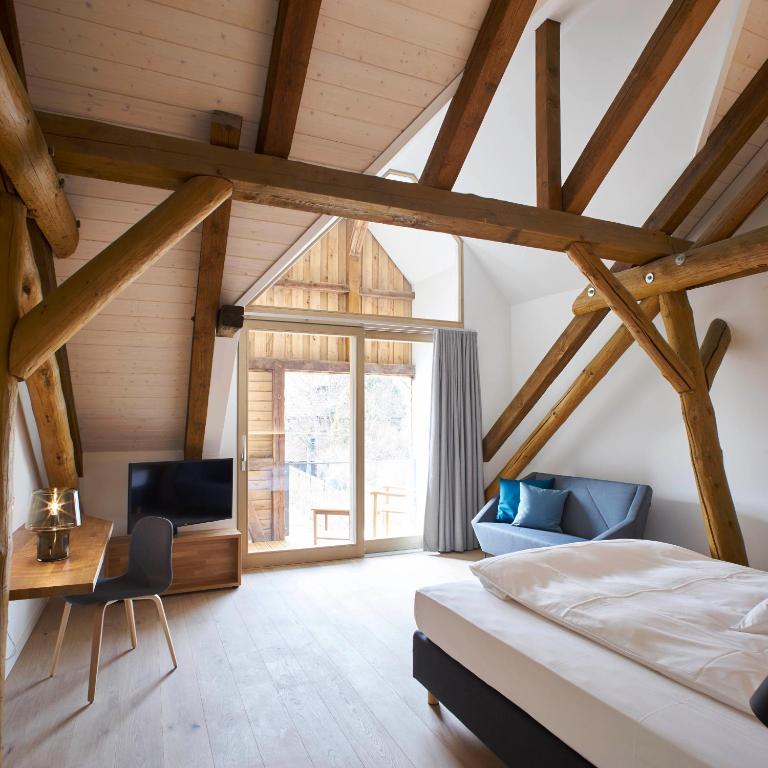 Postel nebo postele na pokoji v ubytování meinwolfsburg hotel auf dem rittergut vormals Yard Boarding Hotel