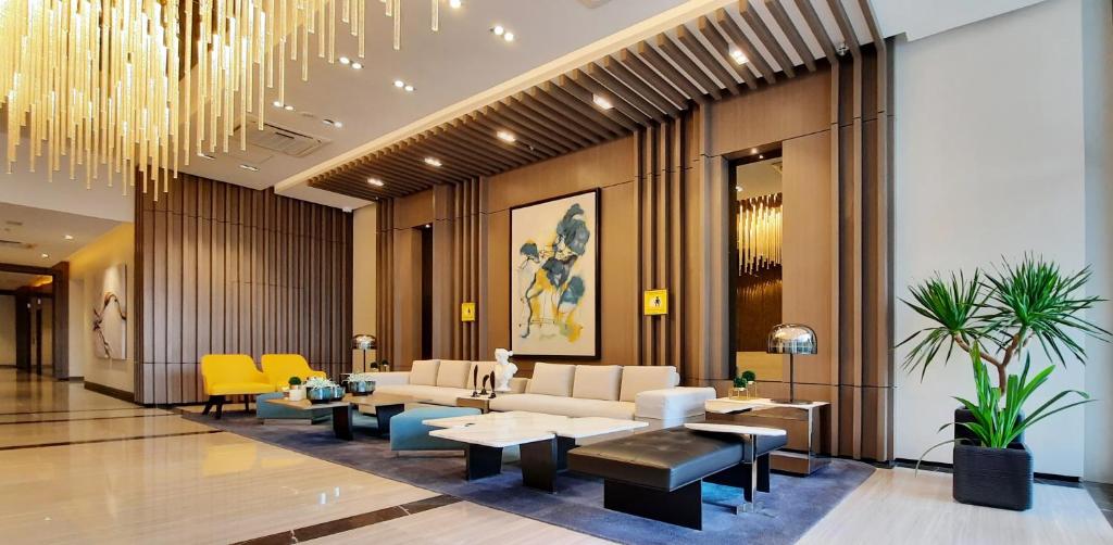 Posezení v ubytování City Lights Apartment in BGC