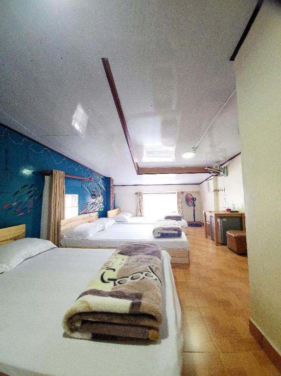 Postel nebo postele na pokoji v ubytování Bình Đào Hotel - Khách sạn ngay trung tâm giá rẻ
