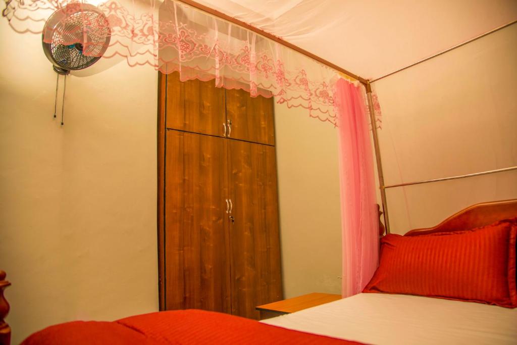 Postel nebo postele na pokoji v ubytování PK Sleek Suites