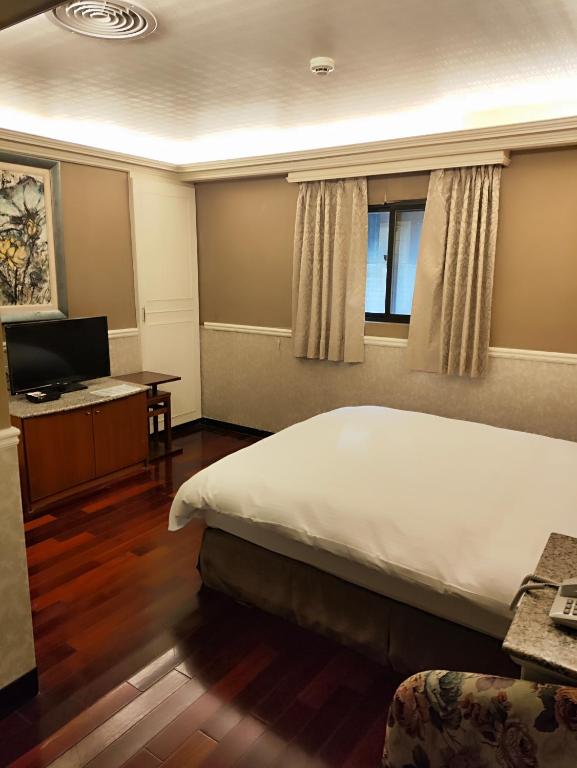 Postel nebo postele na pokoji v ubytování GAWA Hotel