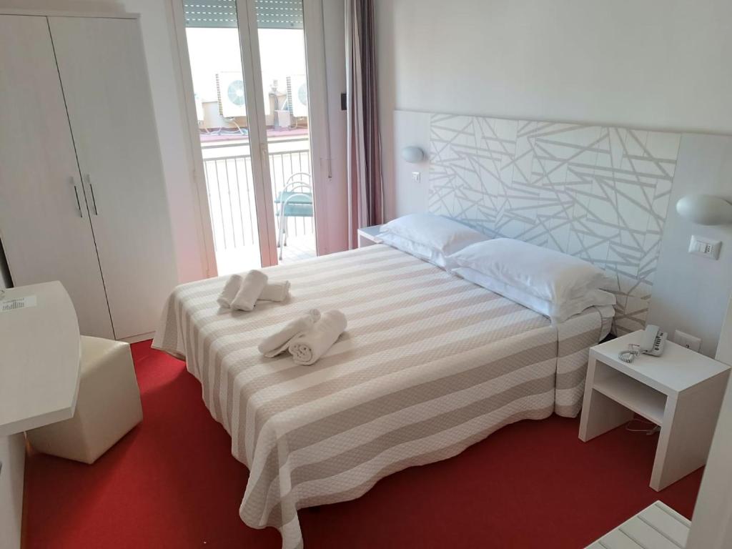 Postel nebo postele na pokoji v ubytování Hotel Berenice