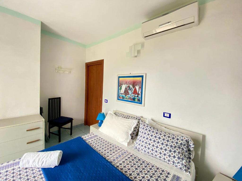 Postel nebo postele na pokoji v ubytování B&B Villa Rosa Angrisano