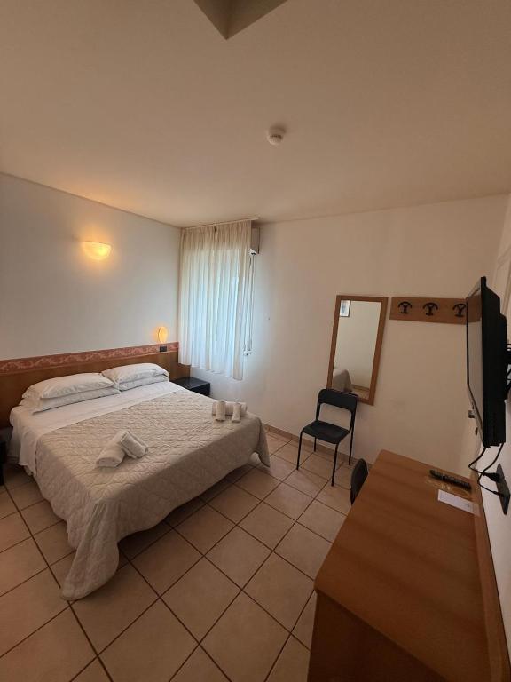 Postel nebo postele na pokoji v ubytování Hotel Berenice