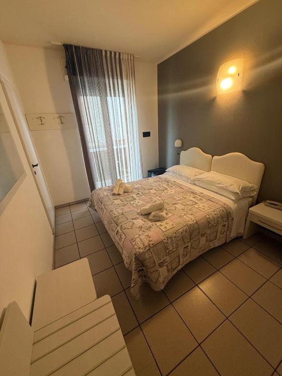 Postel nebo postele na pokoji v ubytování Hotel Berenice