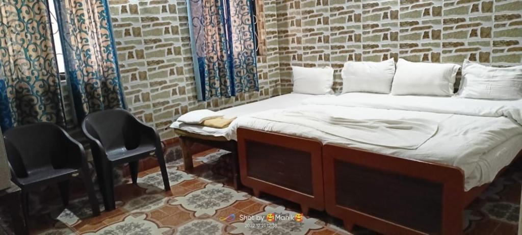 Postel nebo postele na pokoji v ubytování Baga Beachway, GuestHouse