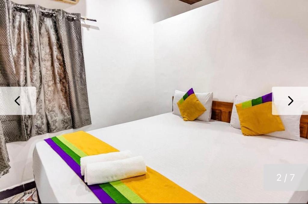 Postel nebo postele na pokoji v ubytování Baga Beachway, GuestHouse
