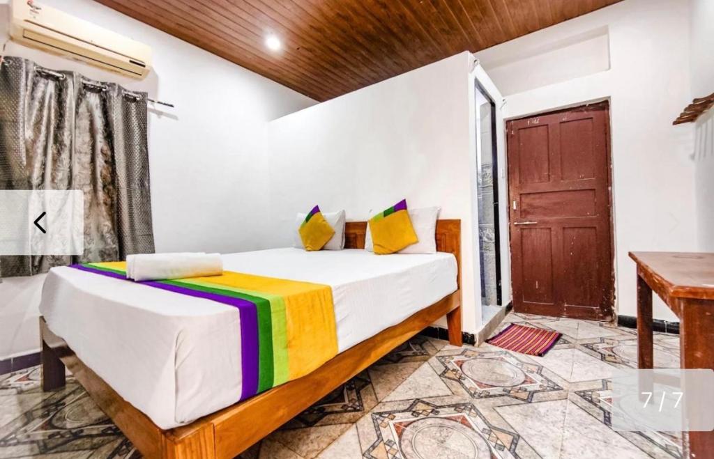 Postel nebo postele na pokoji v ubytování Baga Beachway, GuestHouse