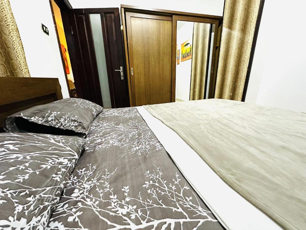 Postel nebo postele na pokoji v ubytování Diamond Arabia Orange
