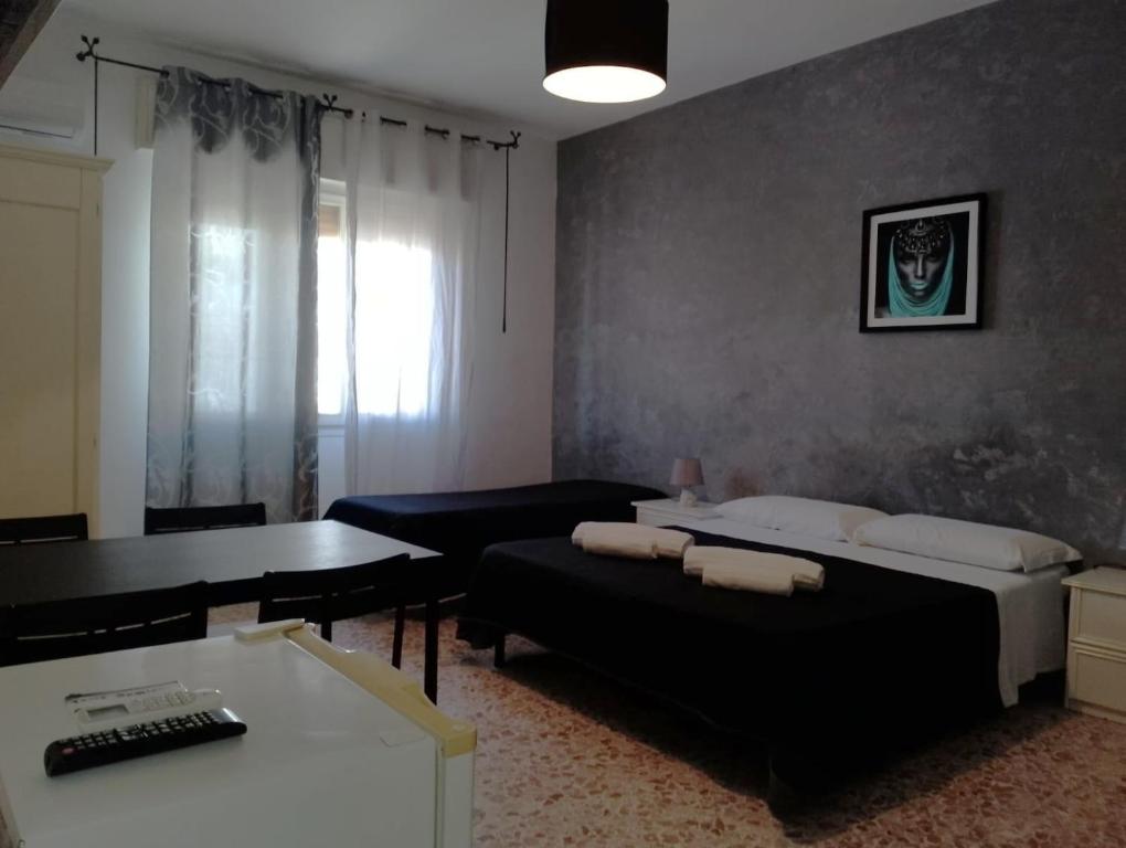 Postel nebo postele na pokoji v ubytování ALGHERO SEASIDE Guest House - Affittacamere
