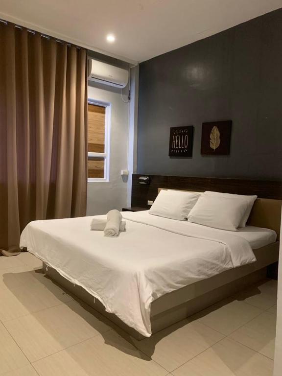 Postel nebo postele na pokoji v ubytování LEUX Hotel Alona Panglao
