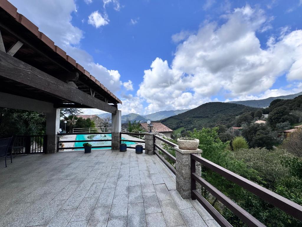 a large patio with a view of the mountains at Nouveau ! Villa avec piscine - Sainte-Marie-Siché in Santa-Maria-Siché