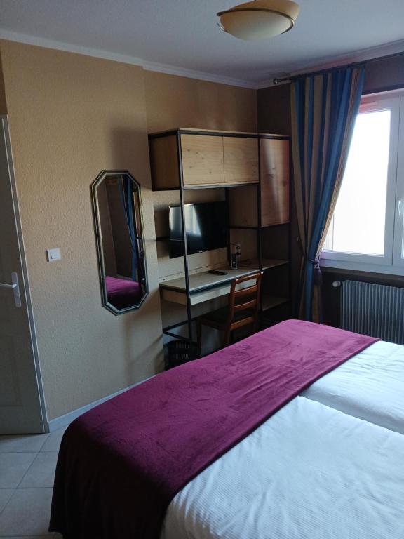 Postel nebo postele na pokoji v ubytování Hôtel l'Orée des Roches