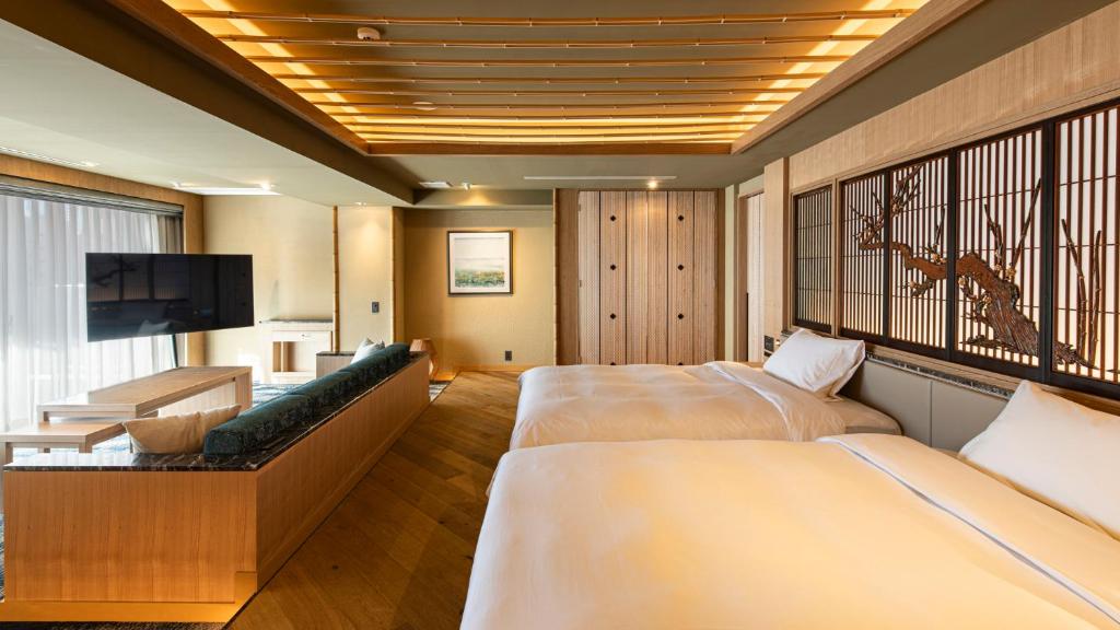 Postel nebo postele na pokoji v ubytování TERRACE HOTEL f 新大阪