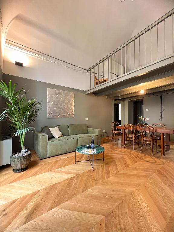 a living room with a couch and a table at Elena Suites - Boutique Apartments in Lecce