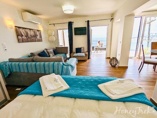 A bed or beds in a room at Kalamata Suites