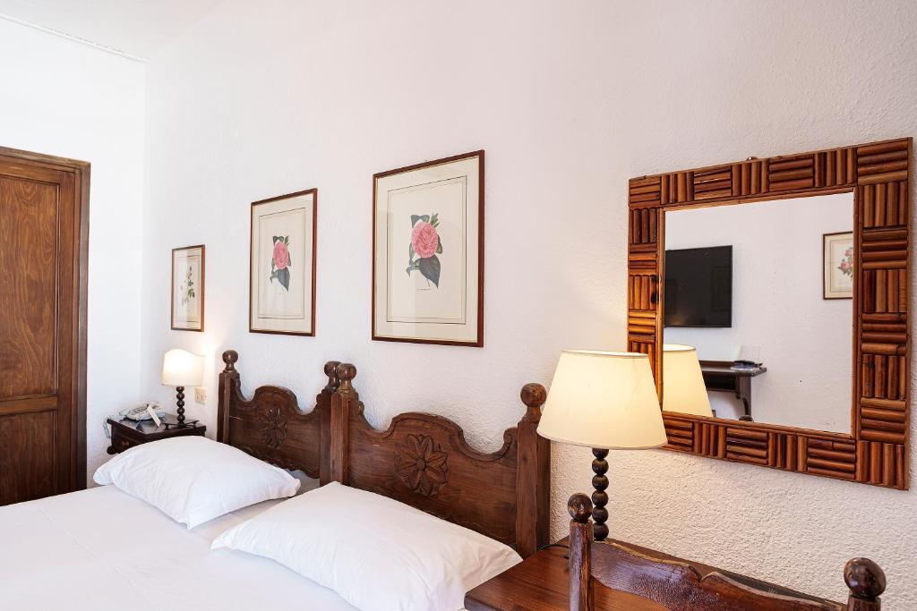 Postel nebo postele na pokoji v ubytování Hotel Le Dune