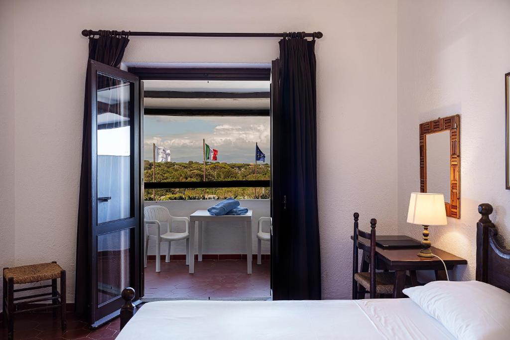 Postel nebo postele na pokoji v ubytování Hotel Le Dune
