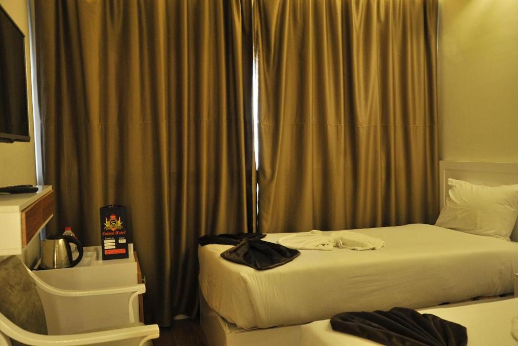 Postel nebo postele na pokoji v ubytování Salma Hotel Cairo