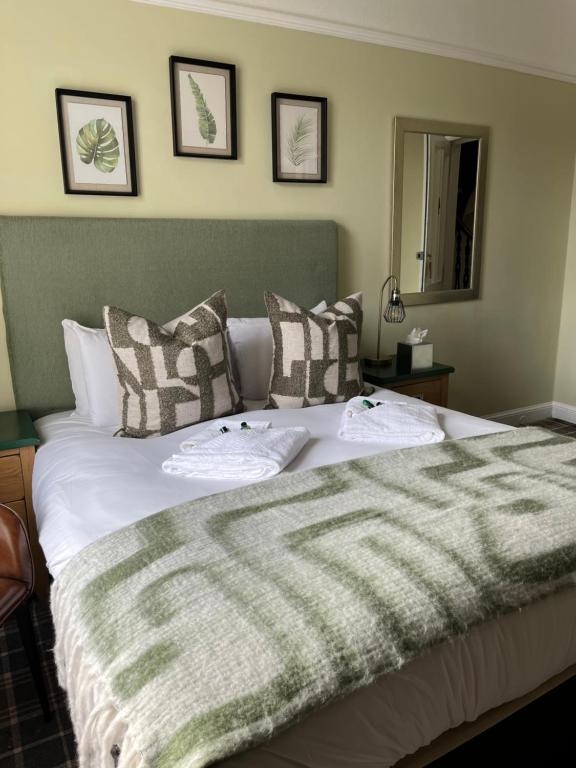 Postel nebo postele na pokoji v ubytování Poppies Hotel