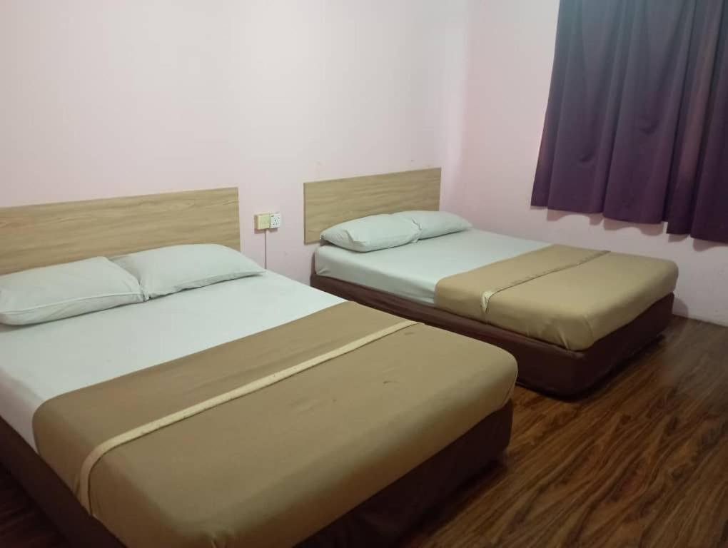 Postel nebo postele na pokoji v ubytování Apollo hotel