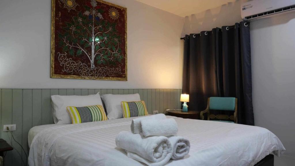 Postel nebo postele na pokoji v ubytování Koko Palm Inn