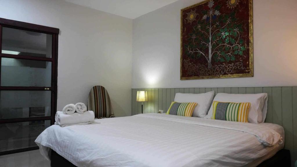 Postel nebo postele na pokoji v ubytování Koko Palm Inn