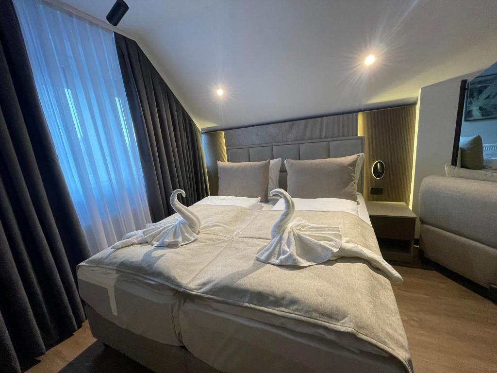 Postel nebo postele na pokoji v ubytování Hotel Heidelux