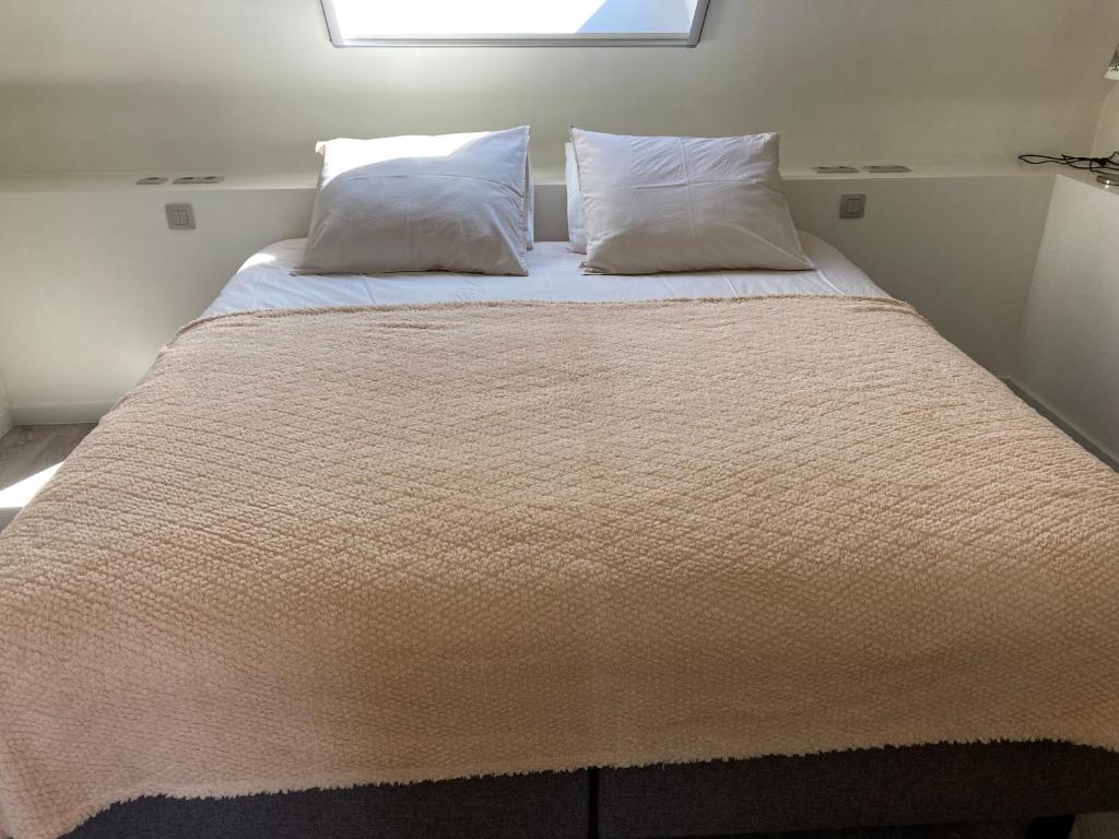 Postel nebo postele na pokoji v ubytování Hoeve Sterrewijk