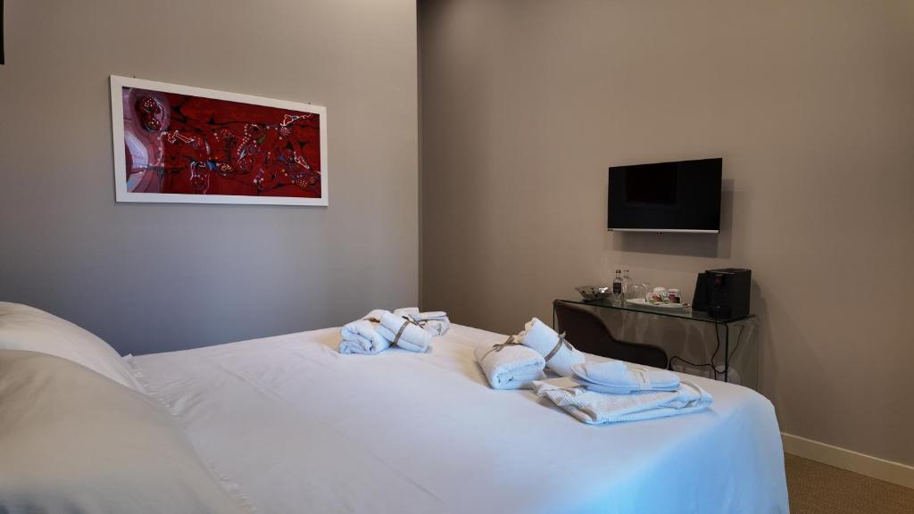 TV a/nebo společenská místnost v ubytování Amelié Lago d’Orta Hotel
