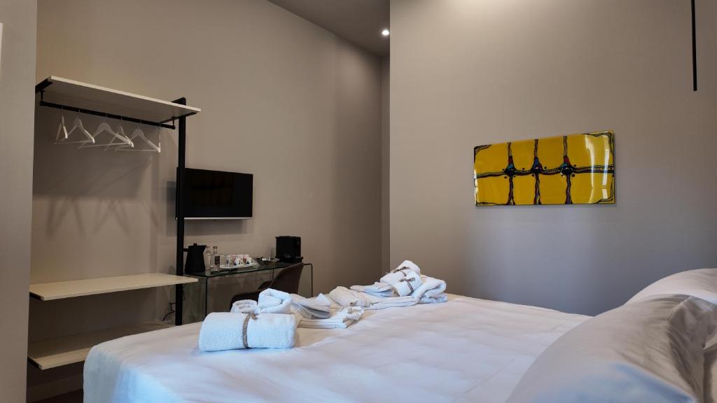 Postel nebo postele na pokoji v ubytování Amelié Lago d’Orta Hotel