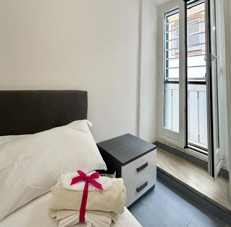 En eller flere senge i et værelse på Nuovo appartamento - Casa D'Amaldi