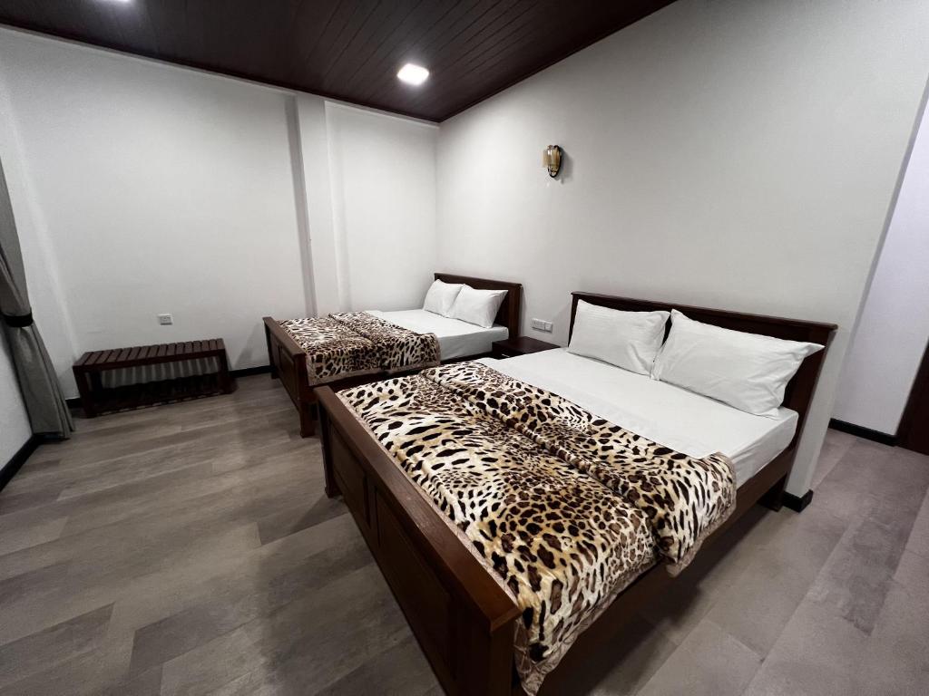 Postel nebo postele na pokoji v ubytování PROMAX villa