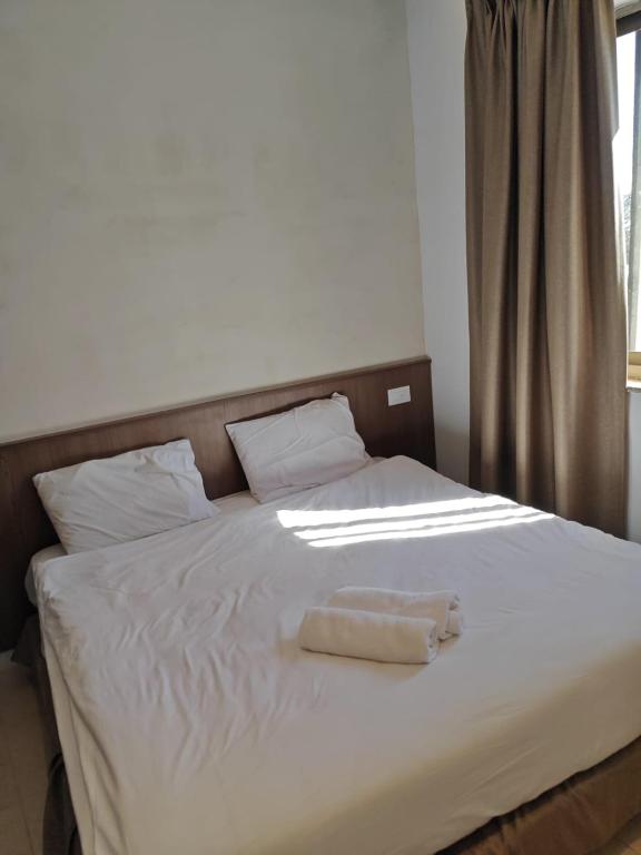 Postel nebo postele na pokoji v ubytování New Metropole Hotel - Jerusalem
