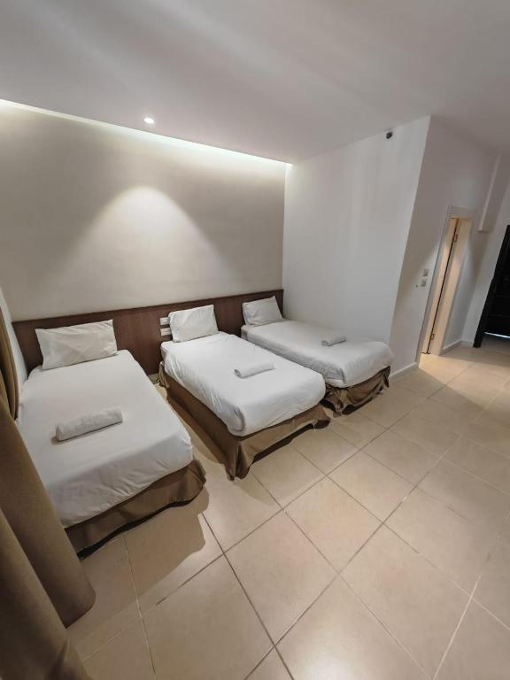 Postel nebo postele na pokoji v ubytování New Metropole Hotel - Jerusalem
