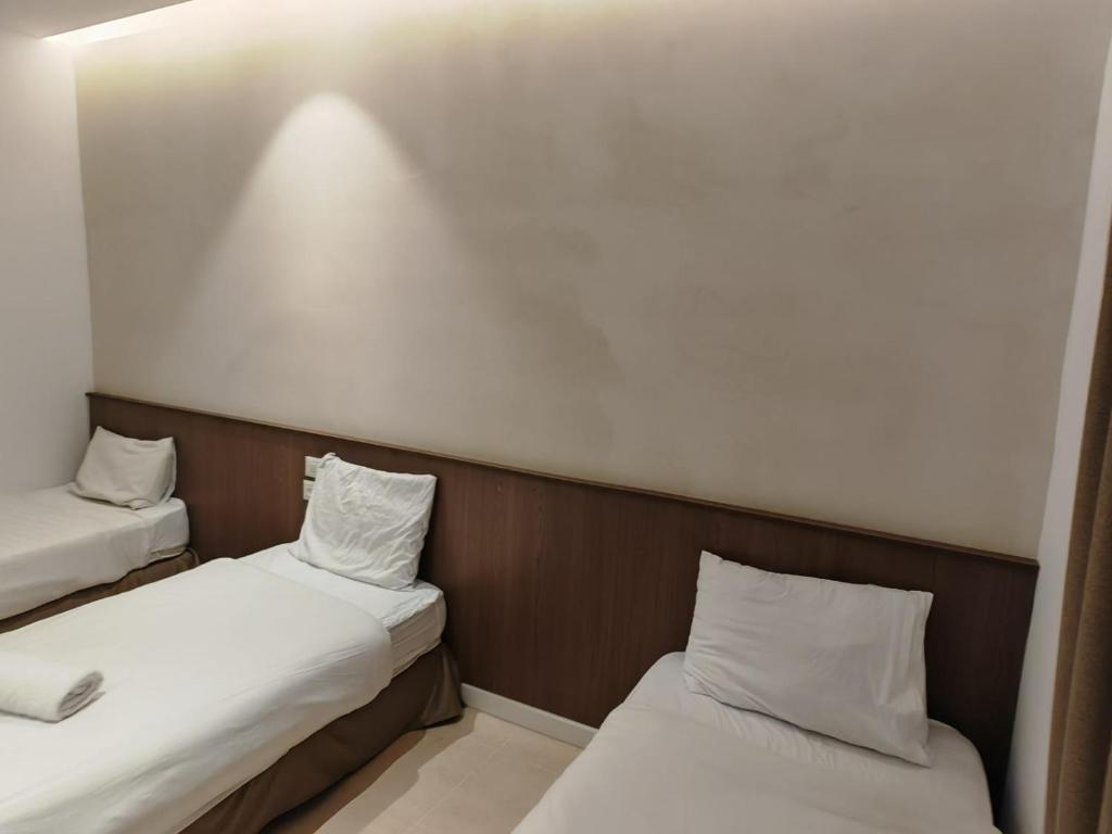 Postel nebo postele na pokoji v ubytování New Metropole Hotel - Jerusalem