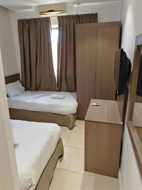 Postel nebo postele na pokoji v ubytování New Metropole Hotel - Jerusalem