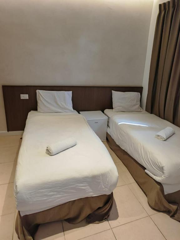 Postel nebo postele na pokoji v ubytování New Metropole Hotel - Jerusalem