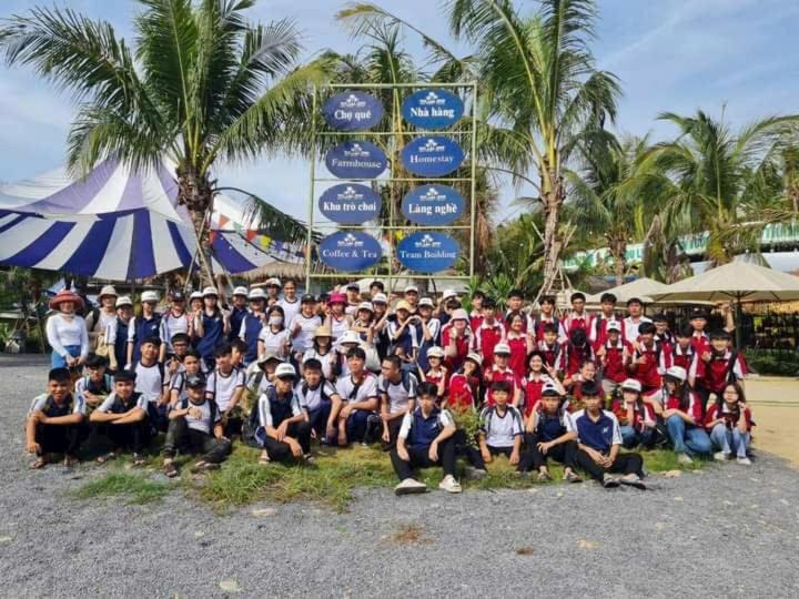 a large group of people posing for a picture at Blue coconut villa in Kon Rung (1)